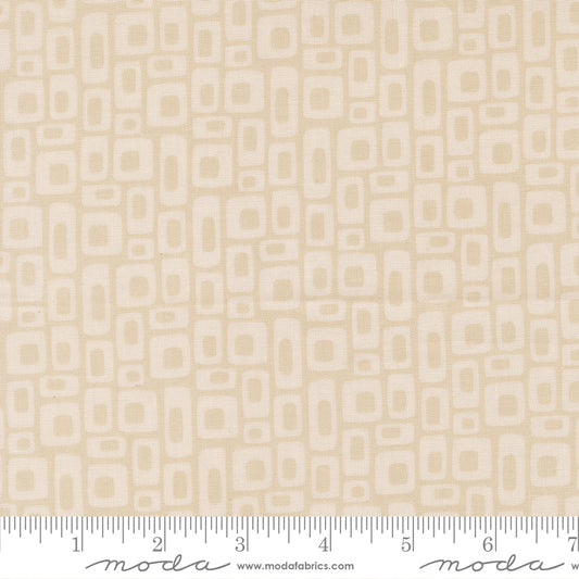 Beige fabric with geometric pattern with a ruler for scale