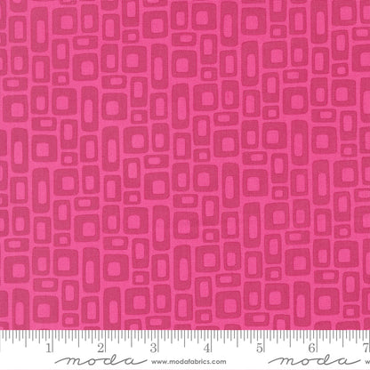 Pink fabric pattern with a ruler at the bottom for scale