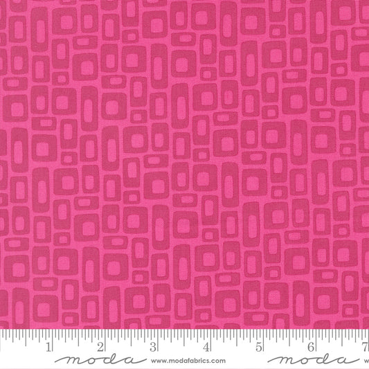 Pink fabric pattern with a ruler at the bottom for scale
