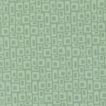 Patterned fabric with geometric shapes on a green background