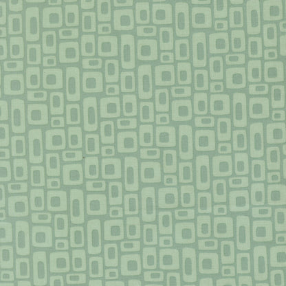 Patterned fabric with geometric shapes on a green background