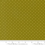 Fabric with star pattern on a green background, featuring a ruler for scale