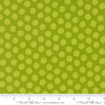 Green fabric with small floral pattern and ruler at the bottom