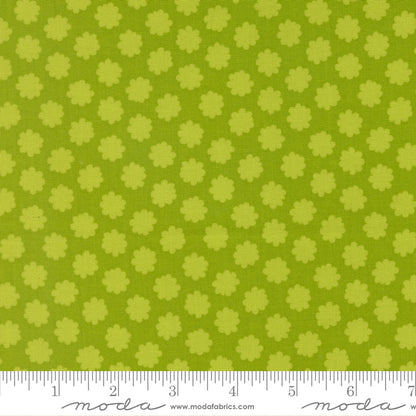 Green fabric with small floral pattern and ruler at the bottom