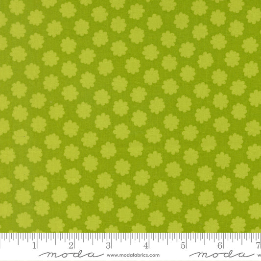 Green fabric with small floral pattern and ruler at the bottom