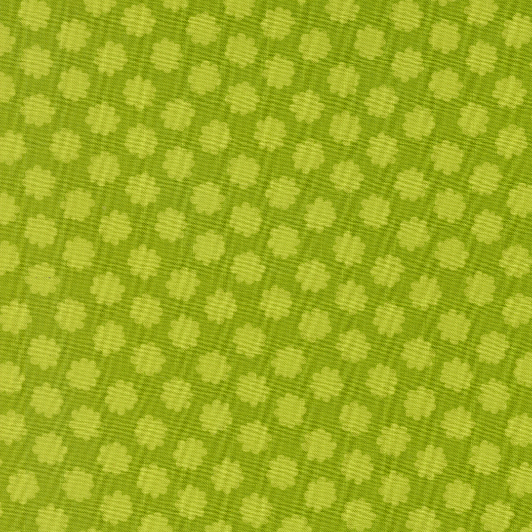 Green patterned fabric with small floral shapes