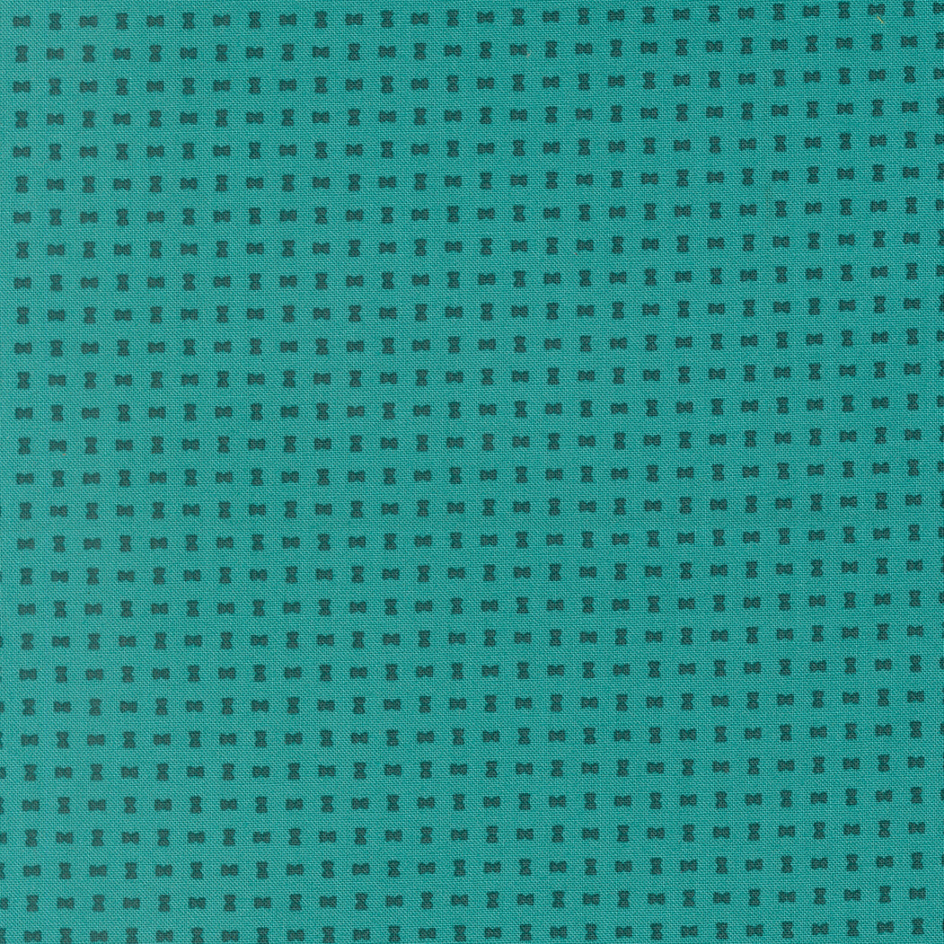 Teal fabric with a subtle geometric pattern