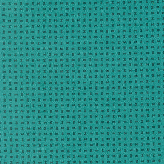 Teal fabric with a subtle geometric pattern