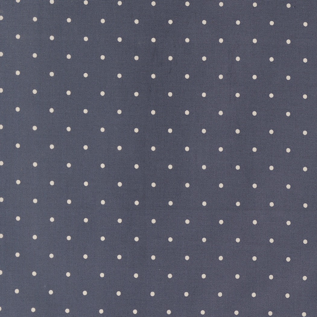 Navy blue fabric with small white polka dots
