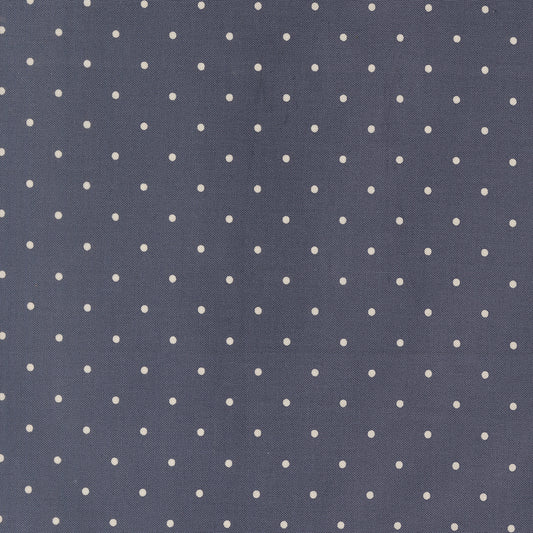 Navy blue fabric with small white polka dots