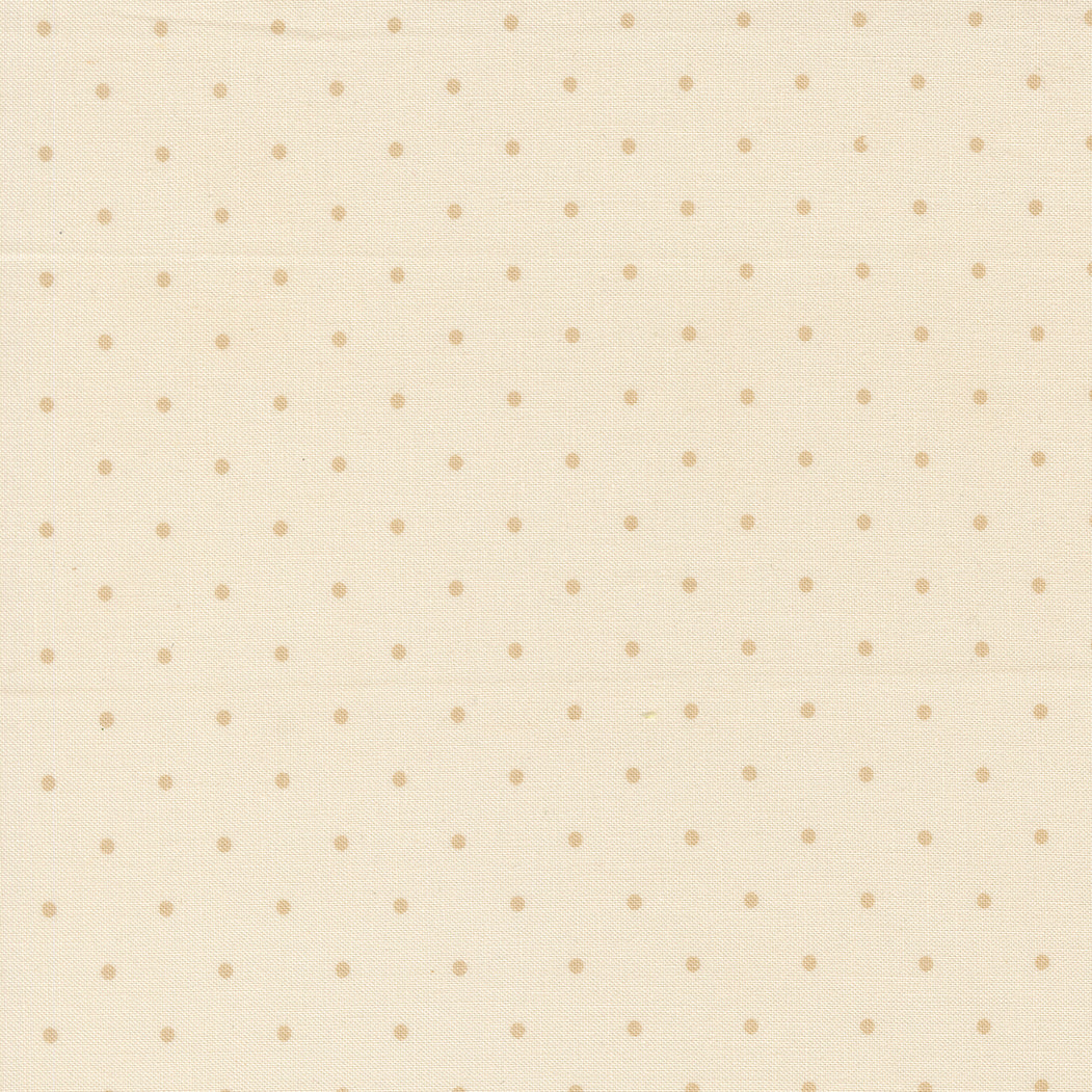 Pattern of small beige dots on a light beige background