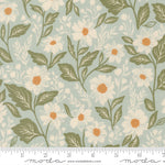Floral pattern with white flowers and green leaves on a light blue background, featuring a ruler for scale