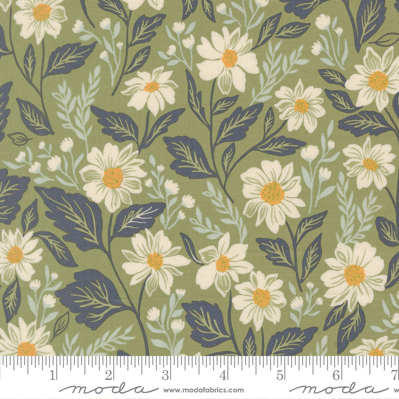 Floral fabric pattern with daisies on a green background, featuring a ruler for scale