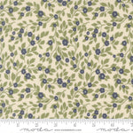 Floral pattern fabric with blue flowers and green leaves on a beige background, featuring a ruler for scale
