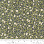 Floral pattern fabric with a ruler for scale on a green background