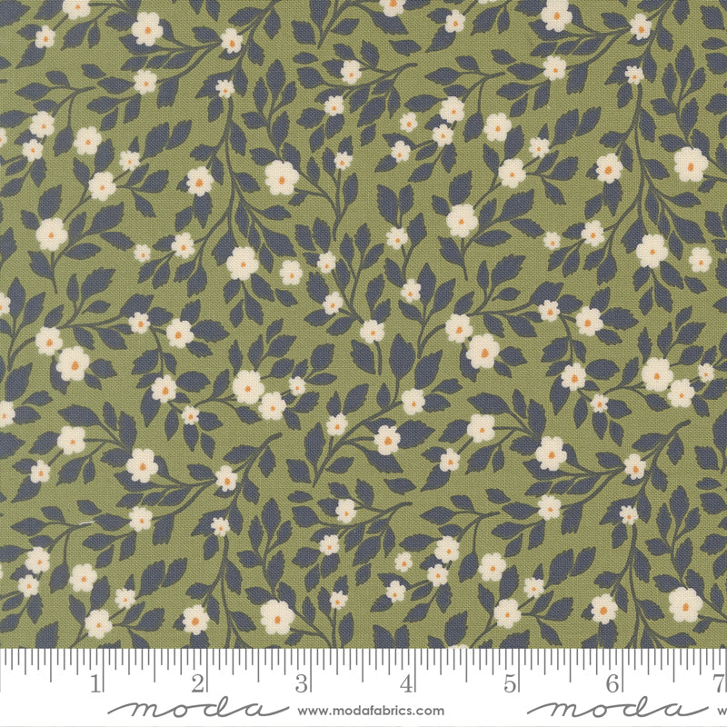 Floral pattern fabric with a ruler for scale on a green background