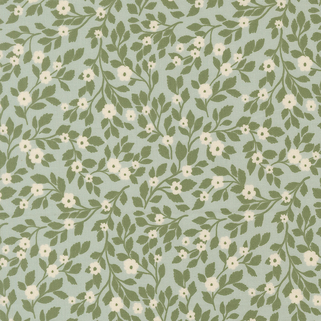 Pattern of green leaves and white flowers on a light blue background