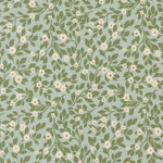 Pattern of green leaves and white flowers on a light blue background