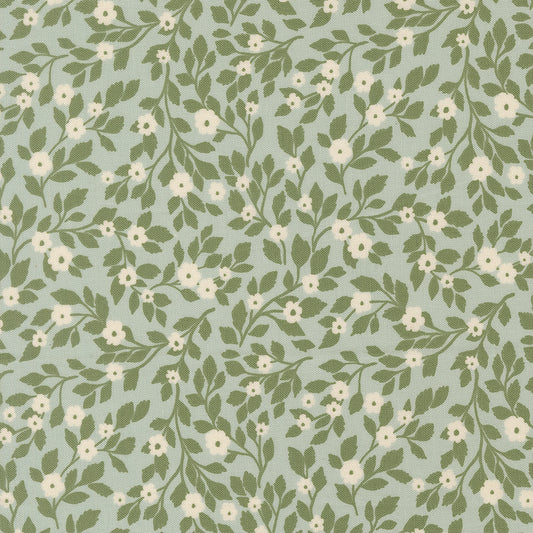 Pattern of green leaves and white flowers on a light blue background