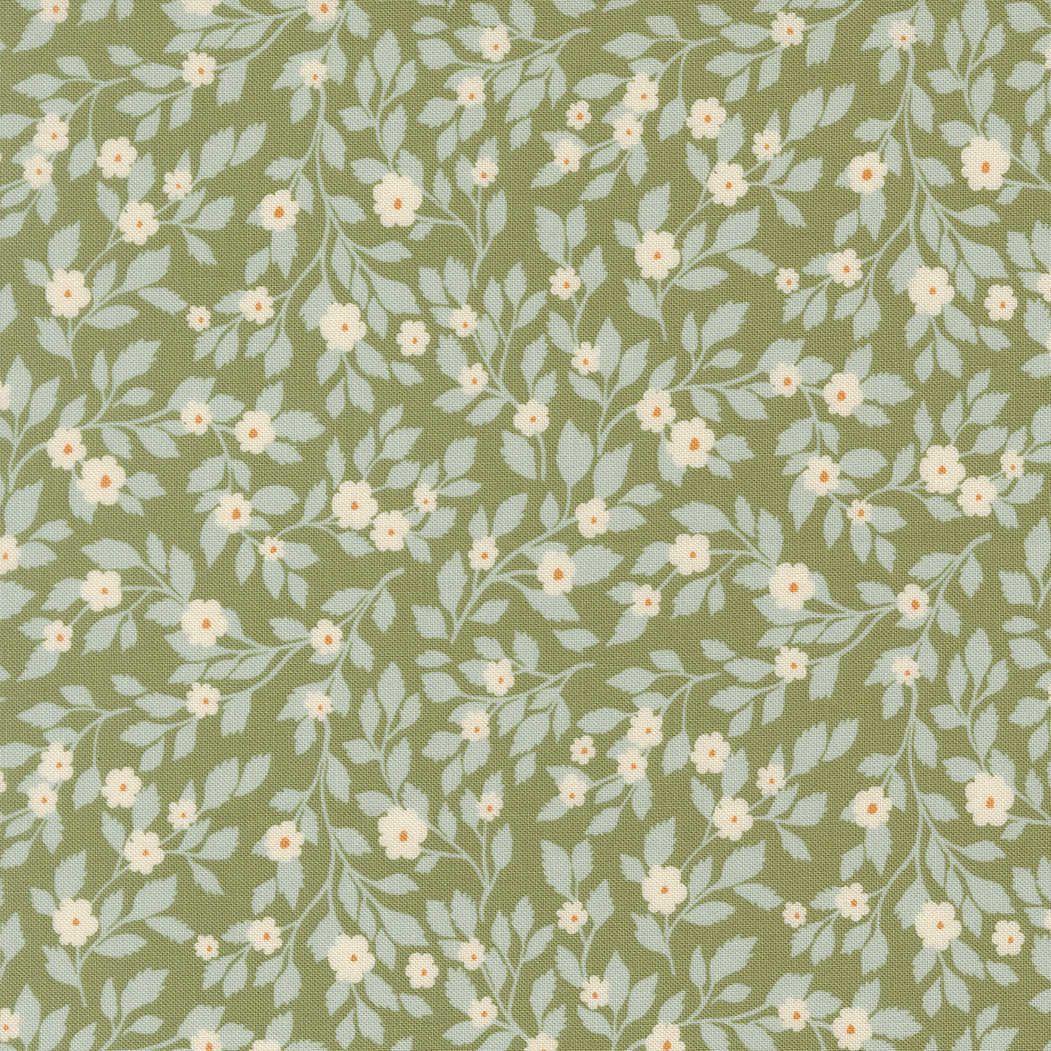 Floral pattern with small white flowers and light blue leaves on a green background