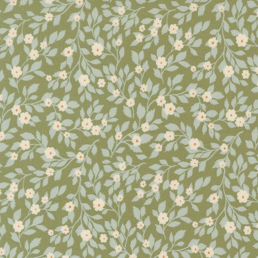 Floral pattern with small white flowers and light blue leaves on a green background