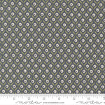 Floral patterned fabric with a ruler at the bottom for scale