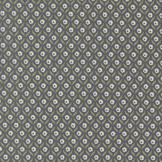 Patterned fabric with small white flowers on a dark blue background