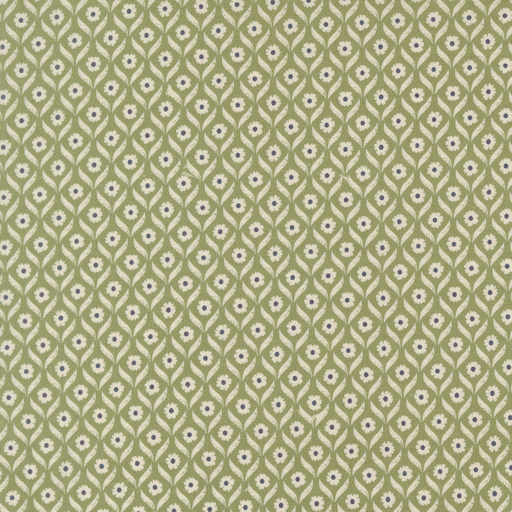 Patterned fabric with small floral design on a green background