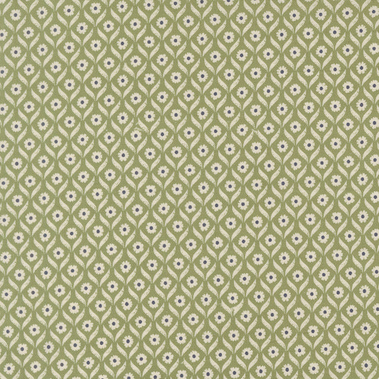 Patterned fabric with small floral design on a green background