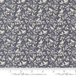 Fabric pattern with birds and leaves on a blue background with a ruler for scale