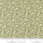 Fabric pattern with birds and leaves on a green background, featuring Moda label.