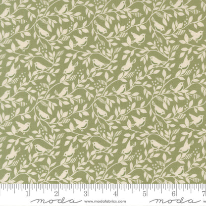 Fabric pattern with birds and leaves on a green background, featuring Moda label.