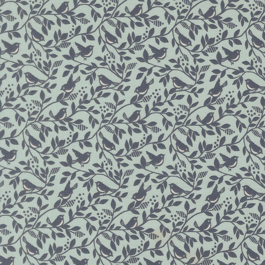Pattern of birds and branches on a light blue background