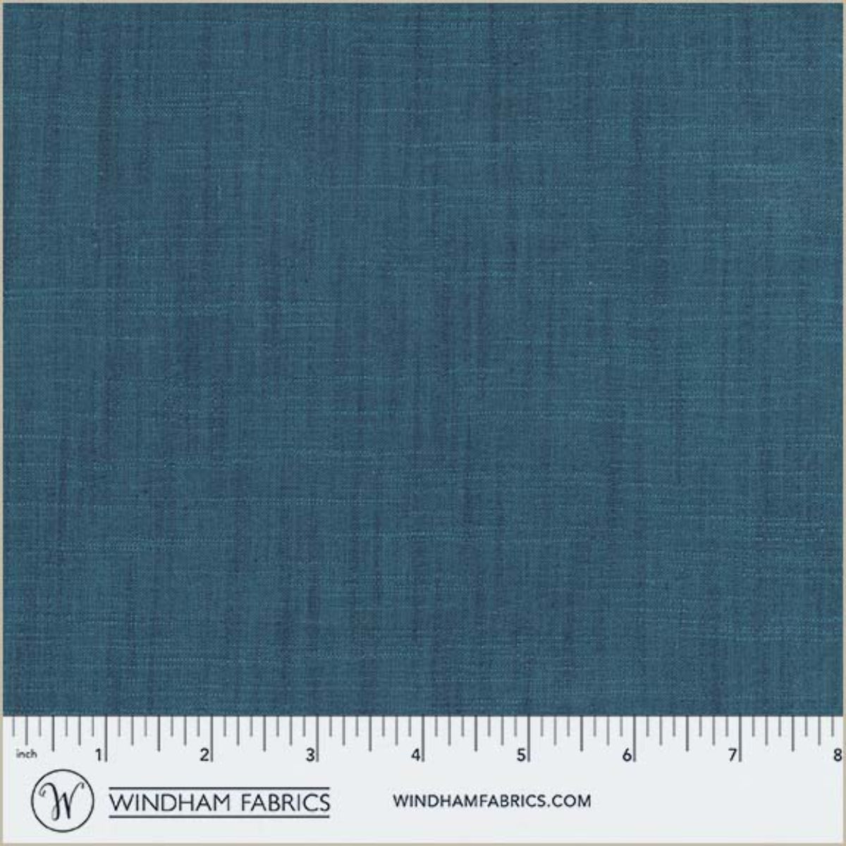 Blue fabric swatch with a ruler at the bottom for scale, branded 'Windham Fabrics'.