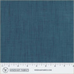 Blue fabric swatch with a ruler at the bottom for scale, branded 'Windham Fabrics'.
