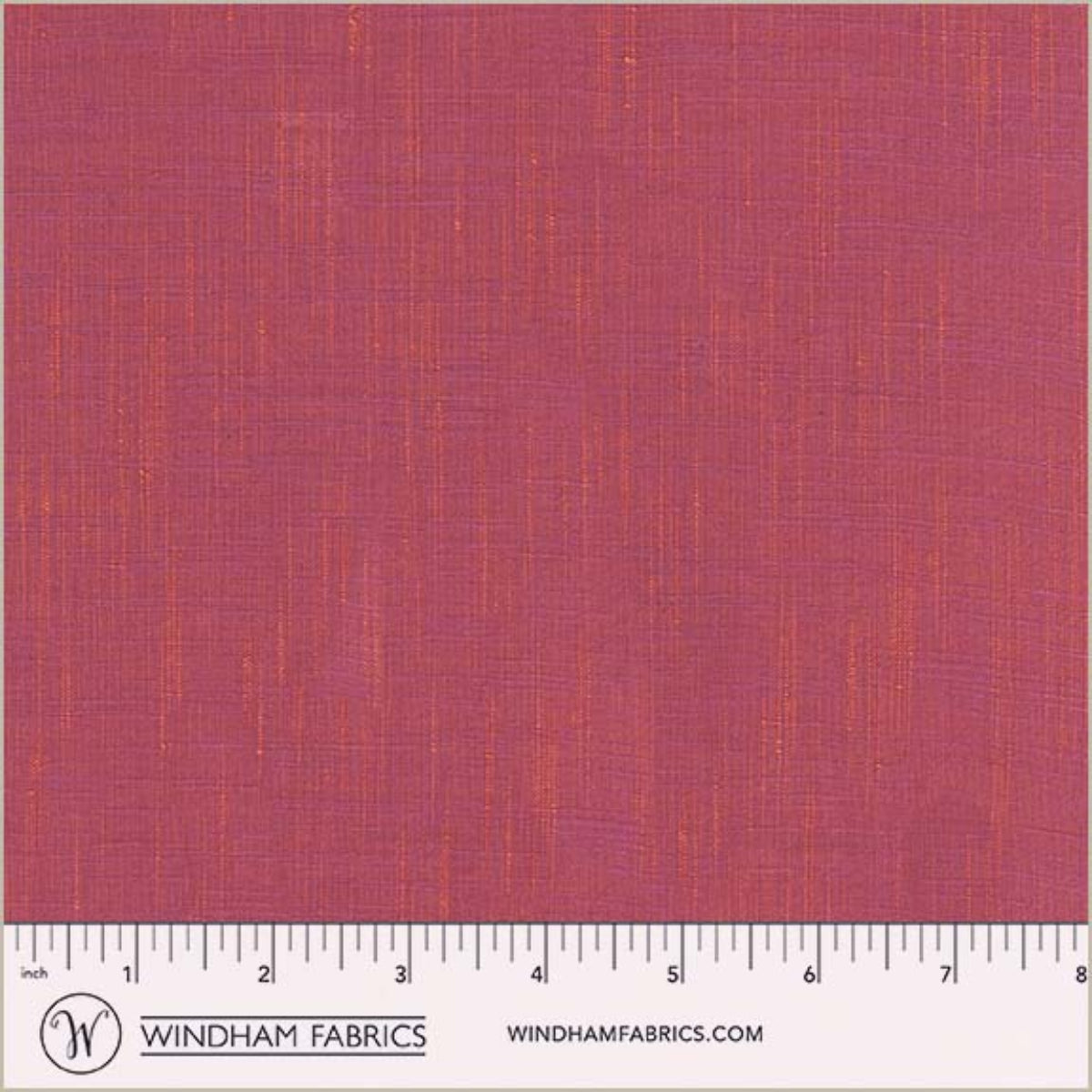 Textured pink fabric swatch with a ruler at the bottom for scale, branded 'Windham Fabrics'.