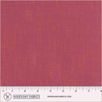 Textured pink fabric swatch with a ruler at the bottom for scale, branded 'Windham Fabrics'.
