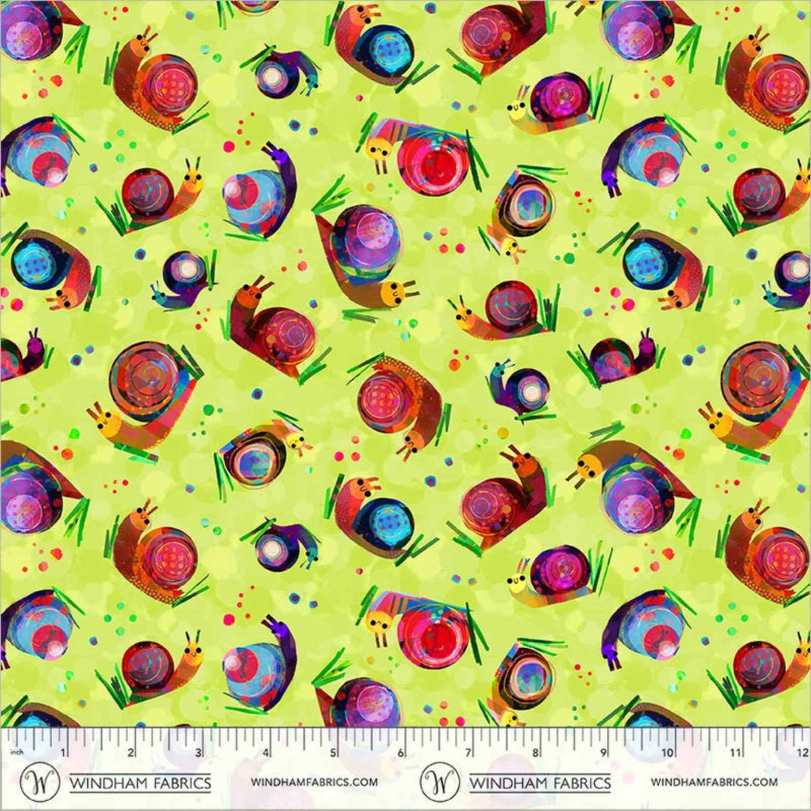 A fabric pattern featuring colorful snails on a light lime green background, with a ruler and Windham Fabrics branding along the bottom edge.