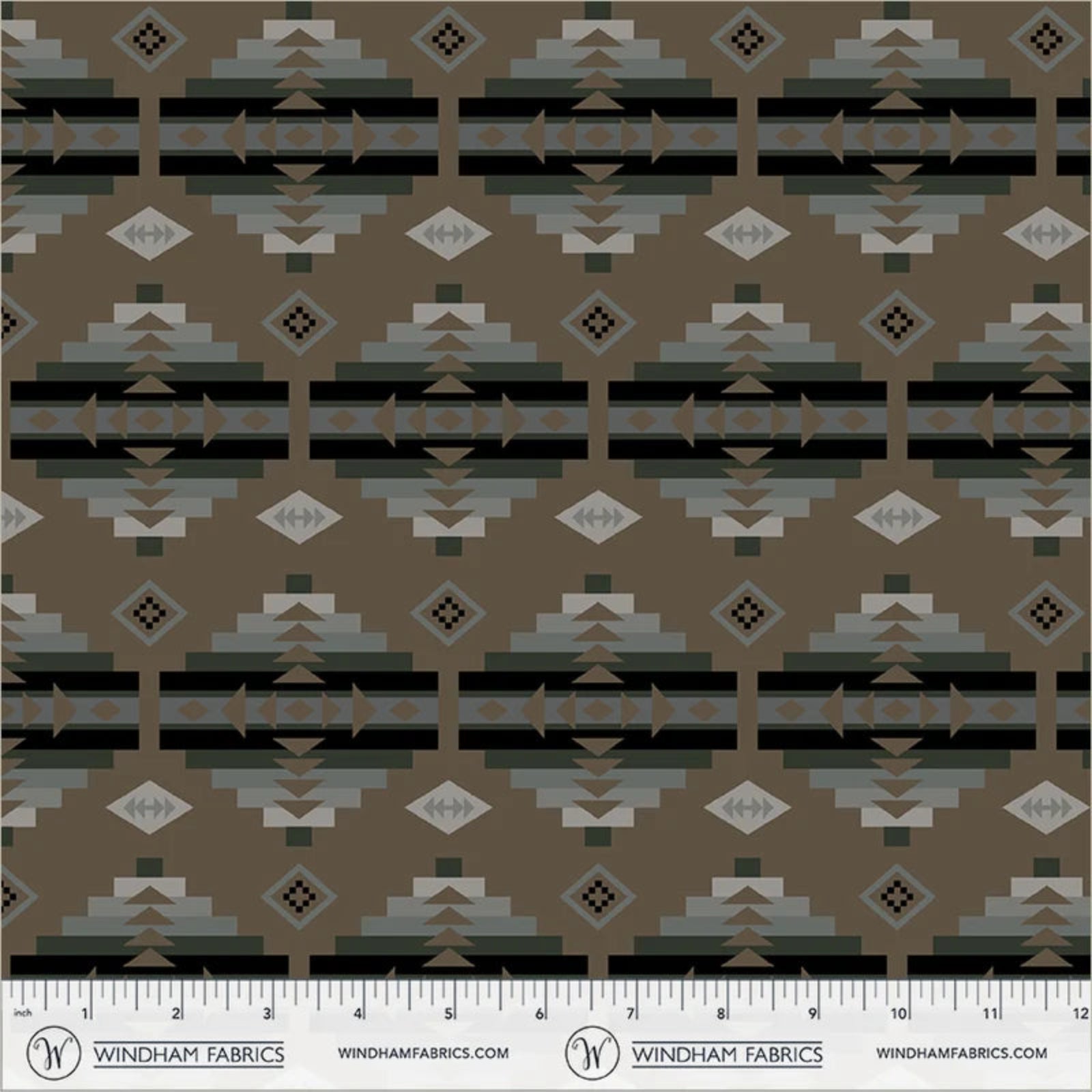 A repeating geometric fabric pattern in earthy tones, featuring horizontal bands with diamonds, triangles, and stepped motifs in brown, gray, black, and beige. A ruler scale and Windham Fabrics branding are visible along the bottom edge.