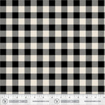 Black and cream buffalo check gingham fabric pattern shown flat with a measuring ruler along the bottom edge displaying 12 inches.