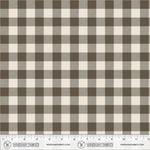 Brown and cream gingham fabric pattern shown flat with a ruler along the bottom edge for scale. Windham Fabrics branding is visible on the ruler.