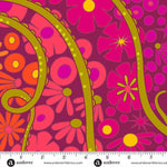 Floral pattern fabric with a ruler at the bottom for scale, featuring pink and orange flowers on a purple background.