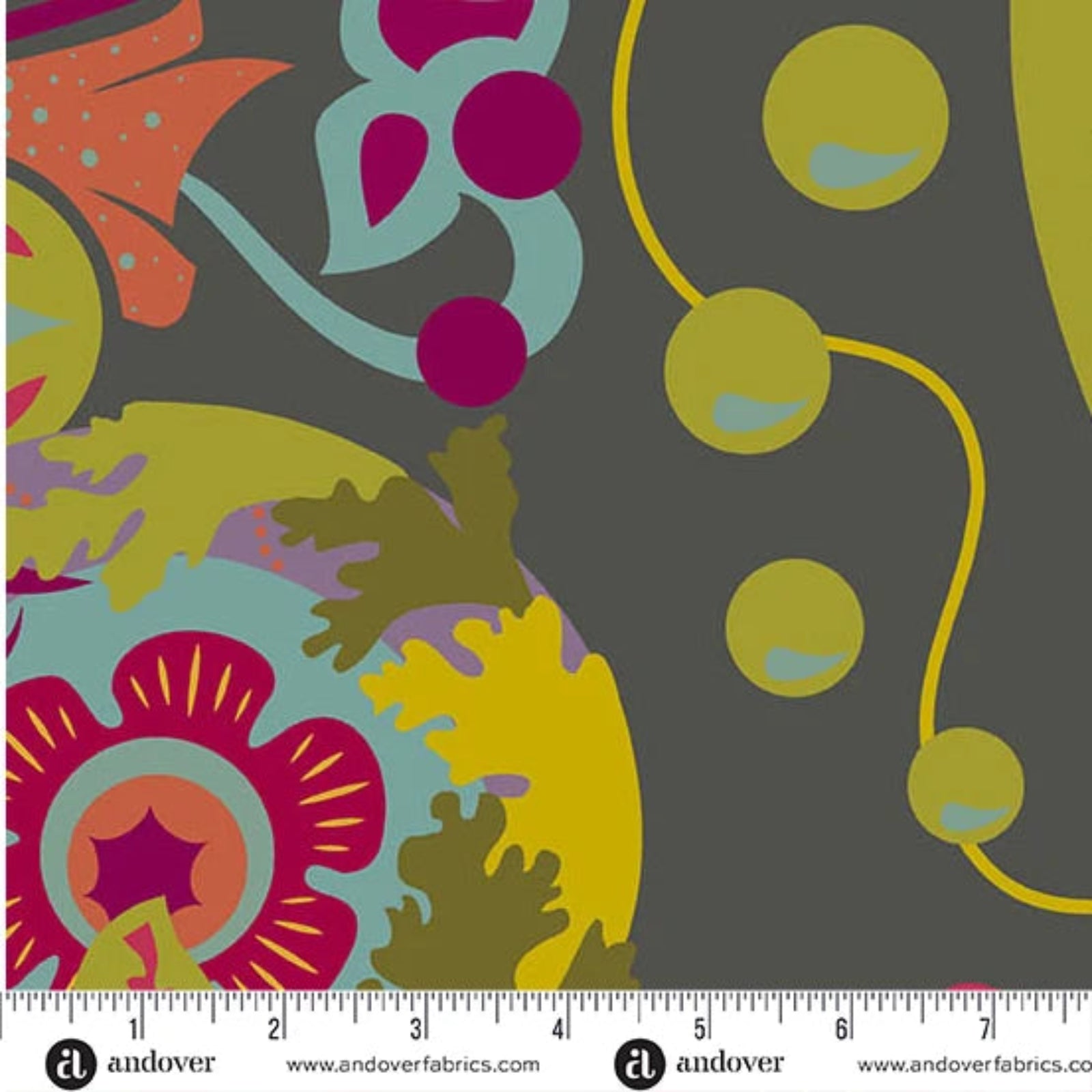Colorful floral and abstract pattern fabric with a ruler at the bottom