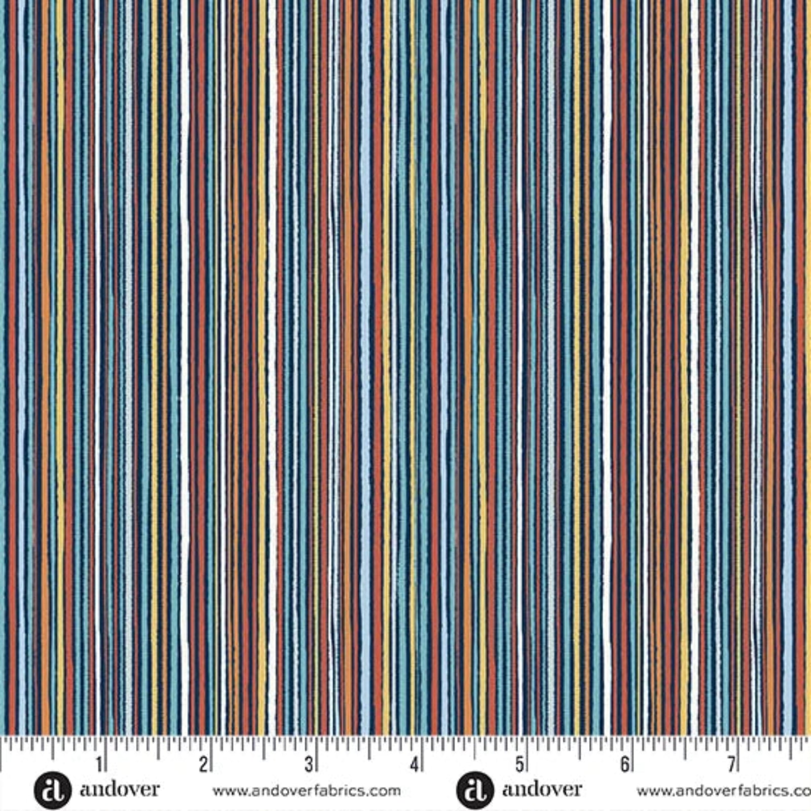 A close-up of a striped fabric pattern with vertical lines in blue, red, orange, yellow, and white, shown with a measurement ruler at the bottom indicating scale. The brand name 'andover' is visible at the bottom.