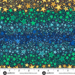 Colorful star pattern fabric with a ruler for scale, featuring gold, green, and blue stars.