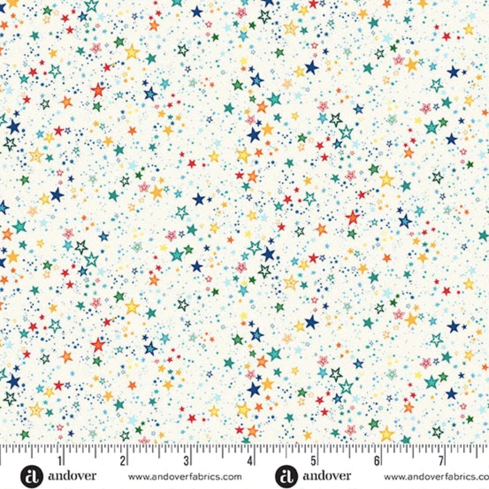Fabric with colorful star pattern and a ruler at the bottom for scale.