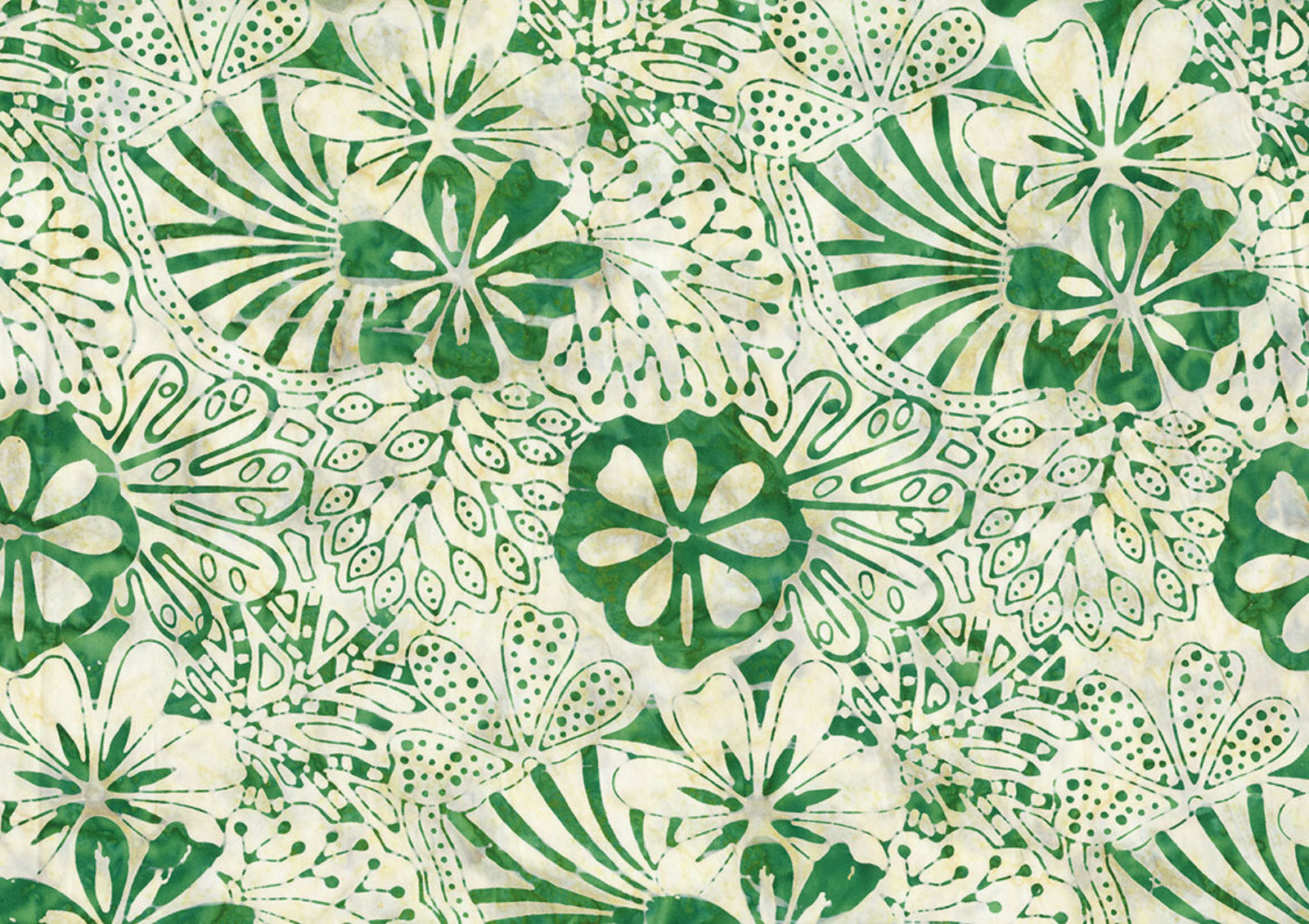 A close-up of a batik fabric pattern featuring green hand-painted style floral and leaf motifs on a warm cream background.