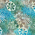A close-up of a batik fabric featuring stylized flowers and leaves in shades of teal, turquoise, green, brown, and cream.