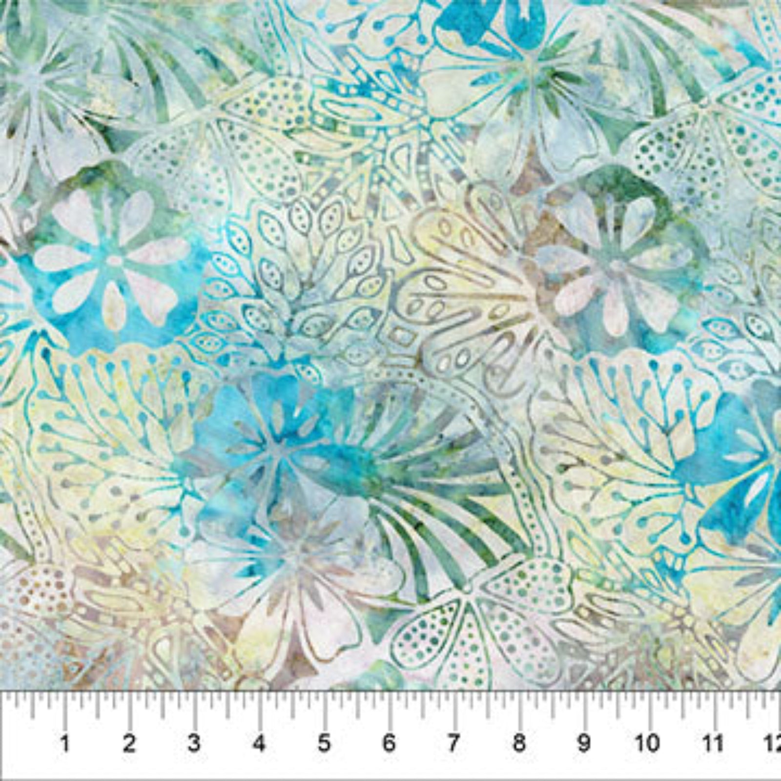 A close-up of a fabric pattern featuring watercolor-style tropical floral motifs in shades of turquoise blue, sage green, and cream, with a white ruler along the bottom edge showing measurements.