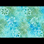 A close-up of a batik fabric pattern featuring stylized hibiscus flowers and leafy motifs in shades of turquoise, teal, and light green.